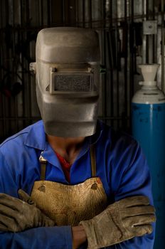 South African or American welder worker wearing saftey mask