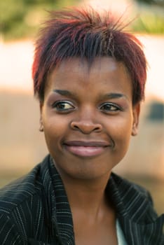 African American businesswoman portrait - looking to the left with selective focus on eyes.