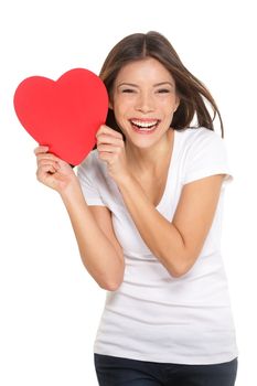 Woman showing heart. Love and valentines day concept with joyful mixed race Chinese Asian / Caucasian young woman smiling cheerful isolated on white background.