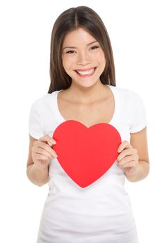 Valentines woman holding heart smiling happy. Love concept with happy multiracial Asian / Caucasian female model isolated on white background.