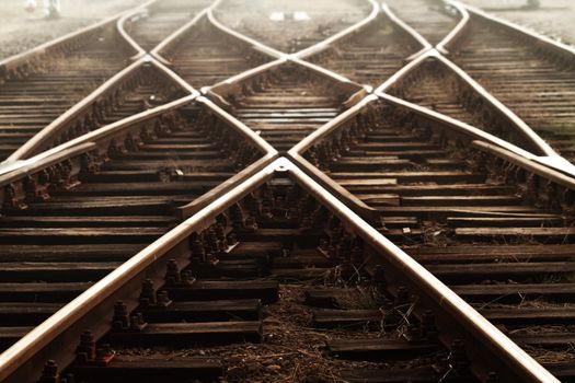 Railway in fog on station, outdoor landscape