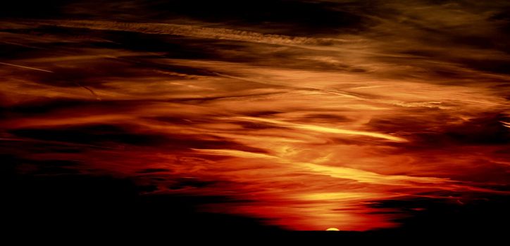 Red sunset sky stormy clouds