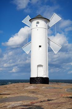 White old lighthouse windmill in Swinoujscie, Baltic Sea, Poland