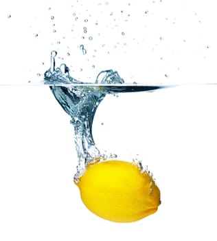 Fresh lemon falling into water. Isolated on white background