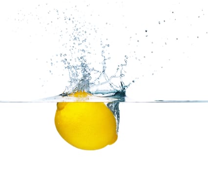 Fresh lemon falling into water. Isolated on white background