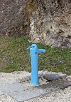 A typical blue street fountain in a park
