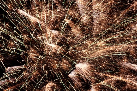 bright holiday fireworks in night sky