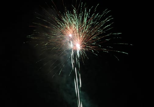 holiday fireworks in night sky