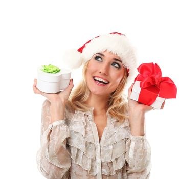 Young casual caucasian woman in red christmas cap holding gifts isolated