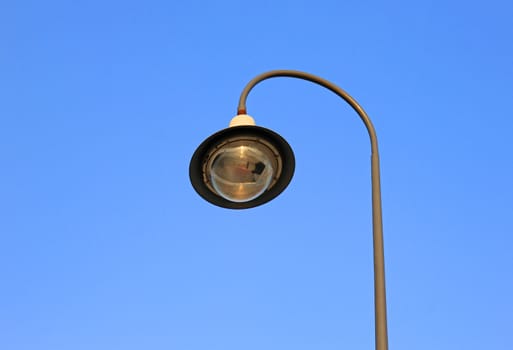 street light against a blue sky 