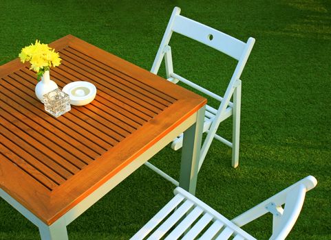 Table and chair setting with flower in outdoor restaurant