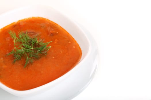 Image of bowl of hot red soup isolated on white background