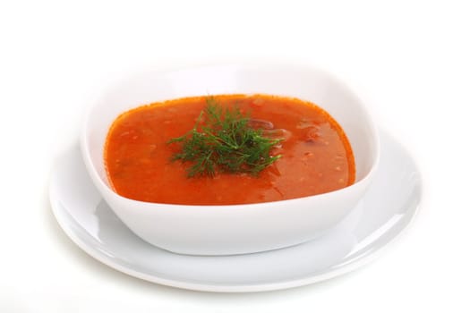 Image of bowl of hot red soup isolated on white background