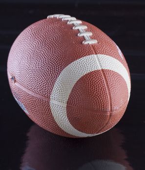 View of a football over a black surface