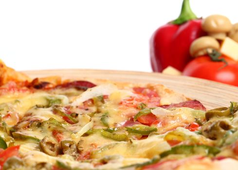 Image of sliced pizza in a plate and vegetables isolated over white background