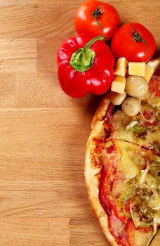 Image of fresh italian pizza on a wooden suface