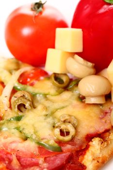 Closeup of tasty italian pizza with vegetables and meat isolated on white backgound