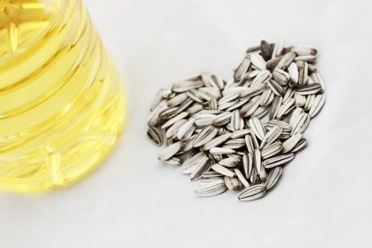 Sunflower seed and oil (white background)