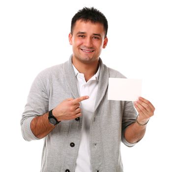 Young handsome man holding blank board ready for text on white background