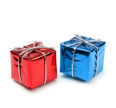 Red and blue miniature present boxes isolated on white