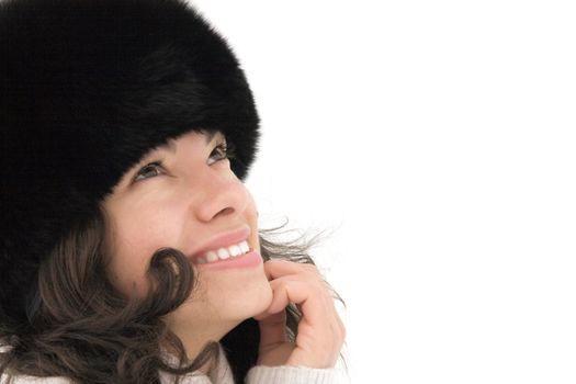smiling cute girl in a winter cap on white background