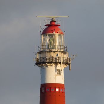 Red and white lighthouse on the dutch isle of Ameland, Holland