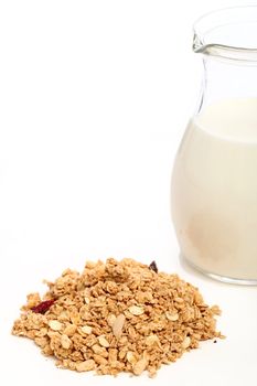 A handful of muesli with milk isolated over white background