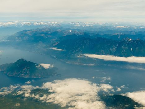 Aerial view of west coast mountain ranges and fiords of Pacific Ocean in western province of beautiful British Columbia, Canada.