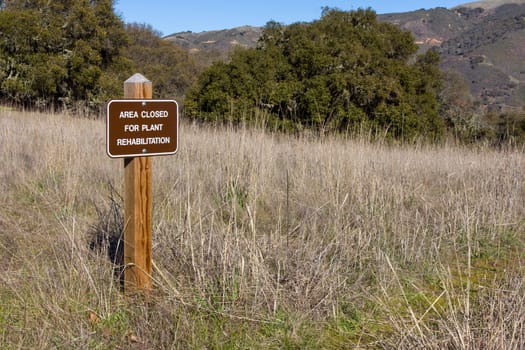 A Sign Informs Hikers that the Area is Closed for Plant Restoration