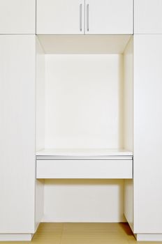 Built-in cabinet in room of an unoccupied newly-built apartment.