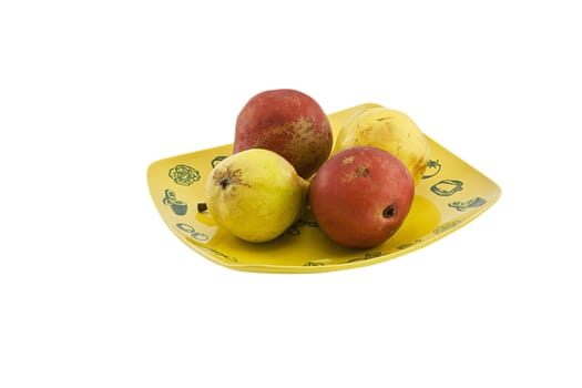 Some yellow and red pears on a bowl isolated on white