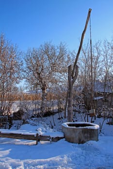 A shadoof with trough in the winter