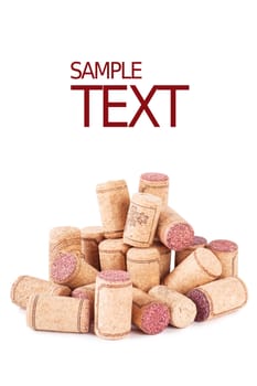 Heap of wine corks over white background