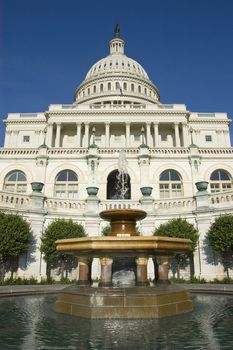 United States Capitol Building with Fountain in the foreground, symmetrical composition