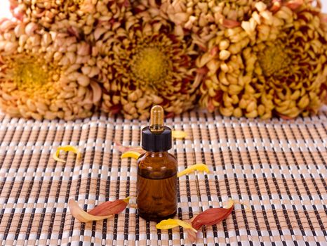Aromatherapy oils with small chrysanthemum flowers
