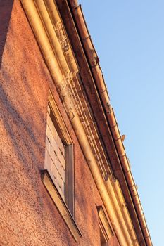 Abandoned house sealed with bricks in winter