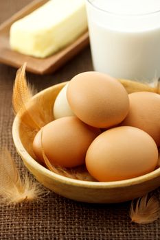 eggs, milk and butter on burlap cloth