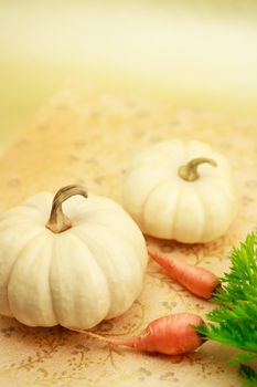 White miniature pumpkin with carrots