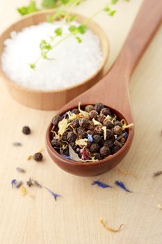 Peppercorn with salt and thyme on cutting board