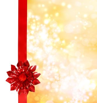 Red Bow and Ribbon with Golden Bokeh Lights Background 