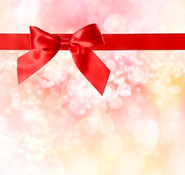Red Bow and Ribbon with  Pink Bokeh Lights Background 