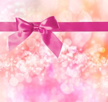 Pink Bow and Ribbon with Pink Bokeh Lights Background 