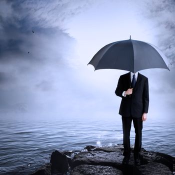 Business Man Holding Umbrella at the Coast After or Before a Storm