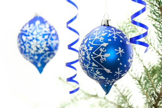 Blue Christmas ornaments on white background