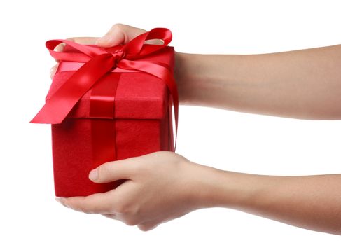 Woman holding a red gift box on a white background