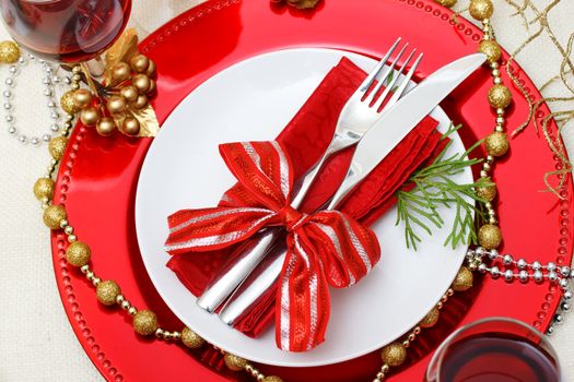 Christmas plate and silverware with red wine