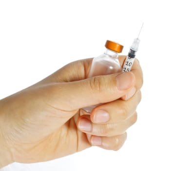 Hand holding a syringe and vial on white background