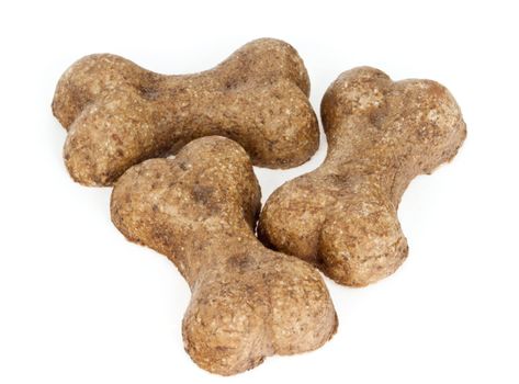 Three dog biscuits isolated on white background