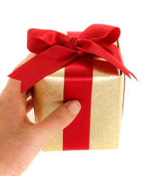Hand holding gift box on white background