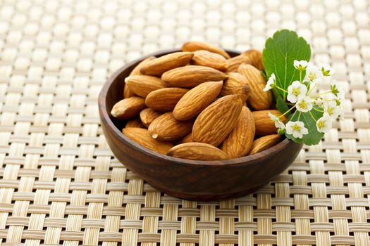 Almonds in wooden bowl